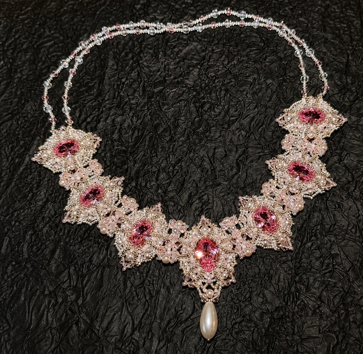 Pink beaded statement necklace with pearl accents for a DIY jewelry project