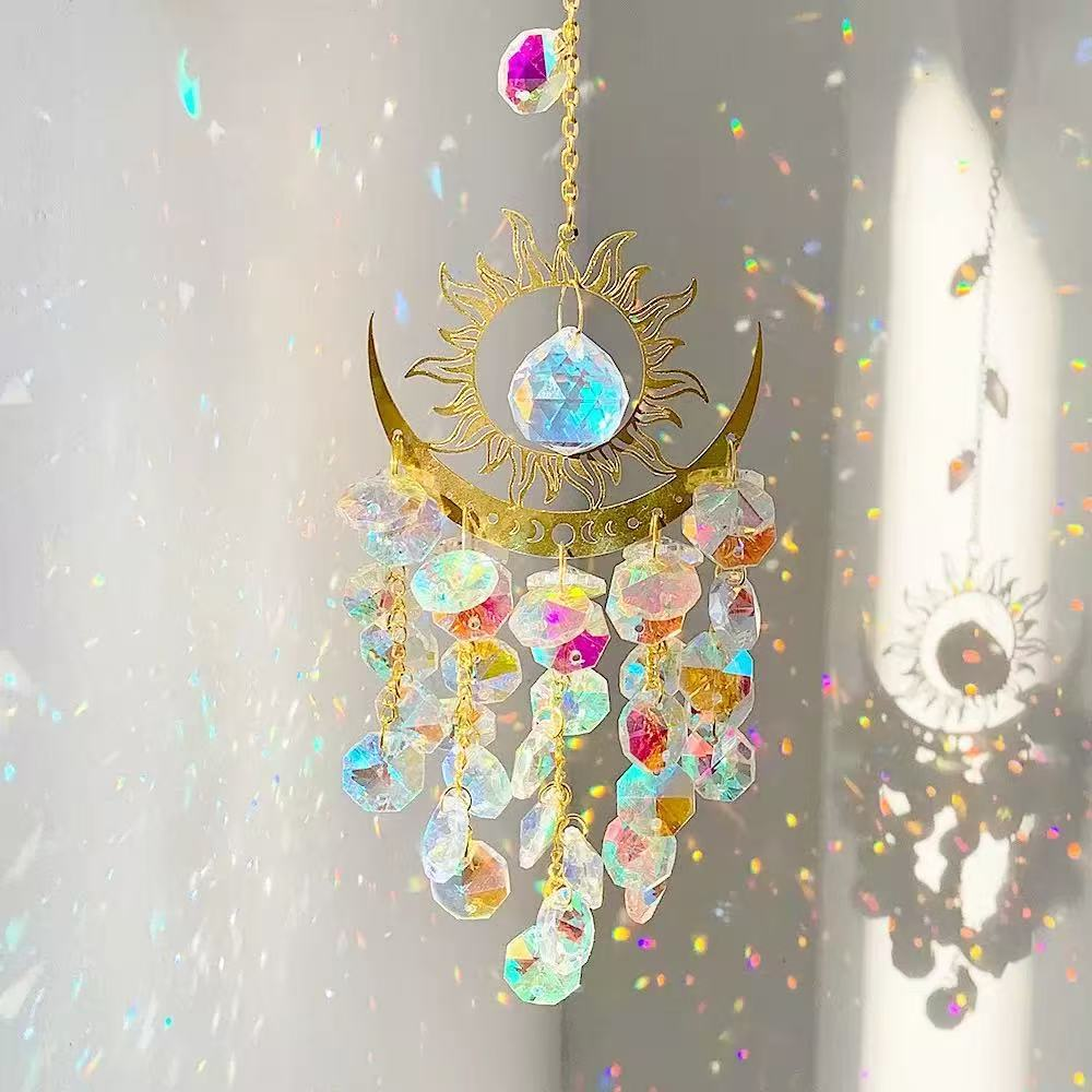 Celestial sun and moon crystal suncatcher casting rainbow light