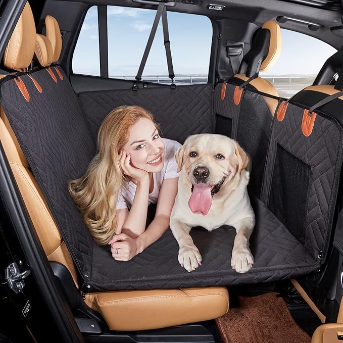 Black hard-bottom dog backseat extender installed in a full-size truck