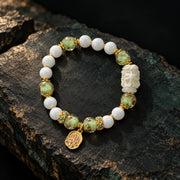 Verdant Counsel sage motif bracelet on dark mineral stone