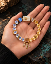 Good Dreams bracelet presented in an open palm