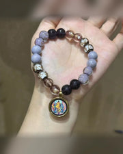 Sword of Clarity Manjushri talisman bracelet displayed in an open palm