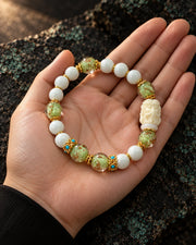 Verdant Counsel bracelet presented in an open palm